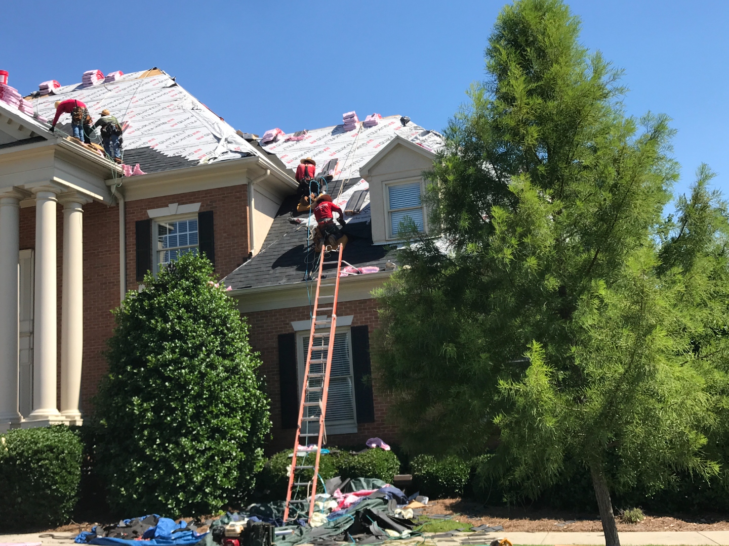 United Ability — crew laying underlayment